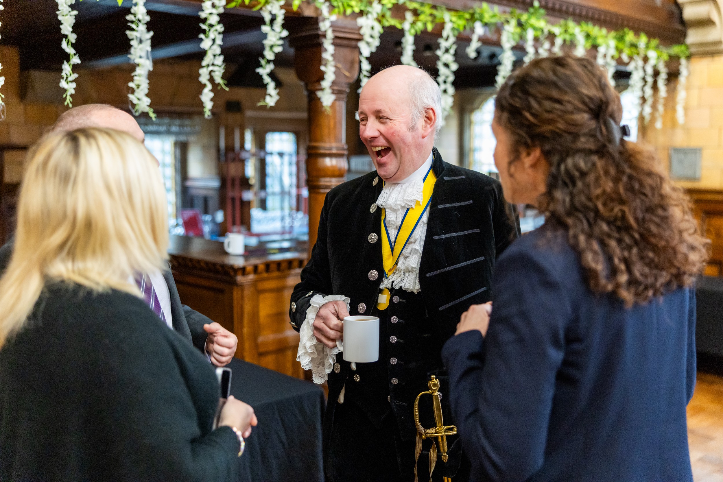 Si Richard talking to colleagues